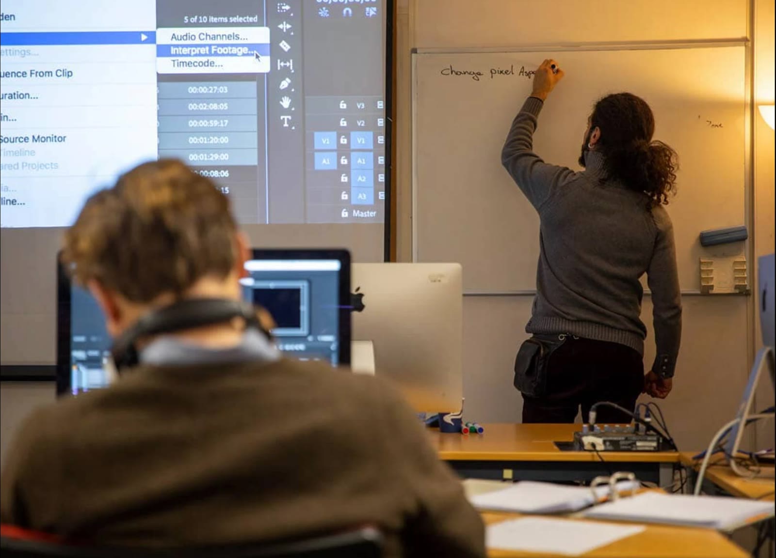 Mani Nickpour teaching video editing in class